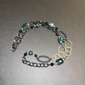 Lia Sophia long necklace with black and dark teal beads.